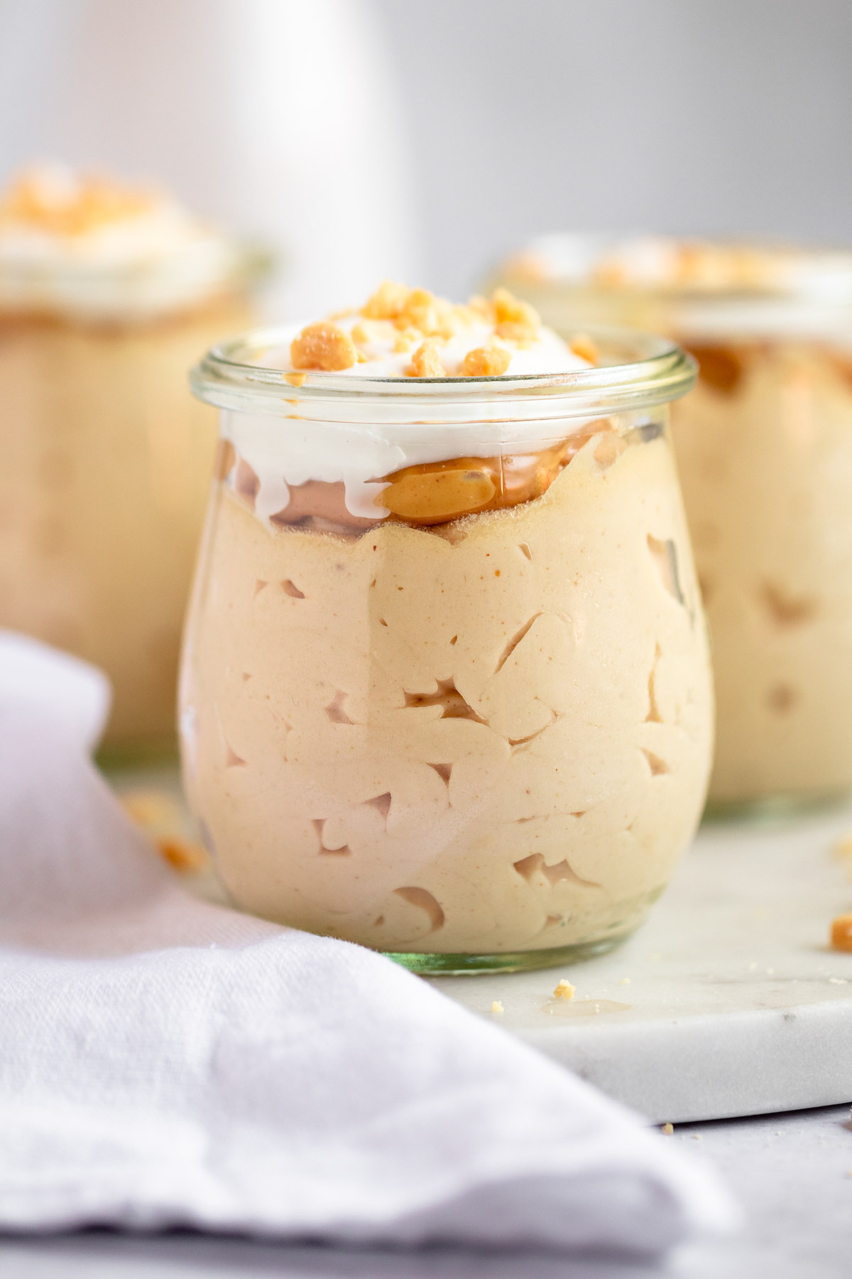 Close up shot of peanut butter mousse in cups.