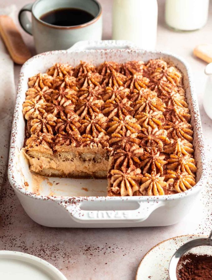 Slice missing from a pumpkin tiramisu.