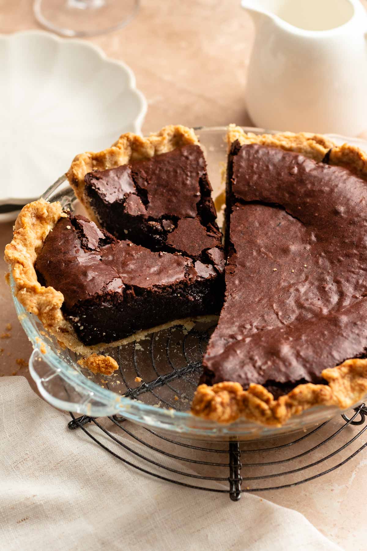 Close up shot of brownie pie with a slice missing.