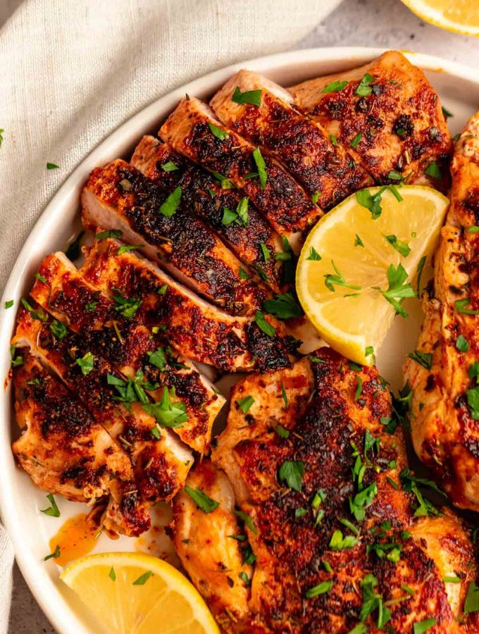 Close up shot of sliced blackened chicken.