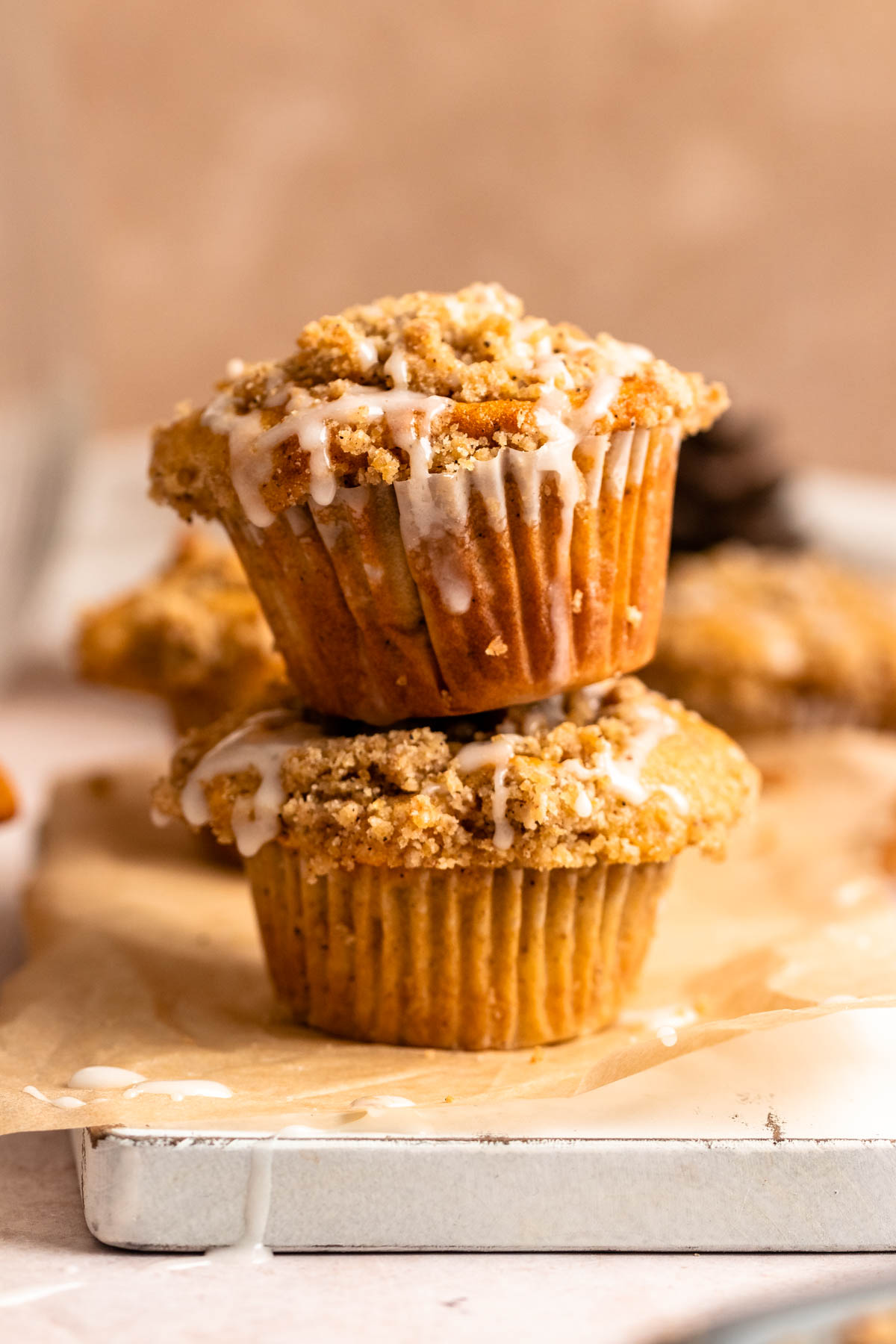 Stack of two cinnamon streusel muffins. 