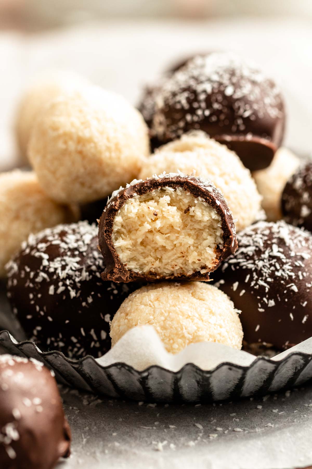 Coconut chocolate balls on a plate.