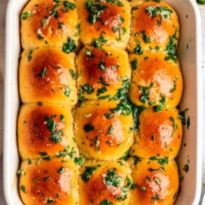 Top of garlic rolls with garlic herb butter on top.