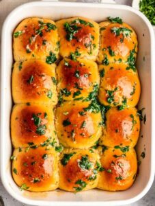 Top of garlic rolls with garlic herb butter on top.