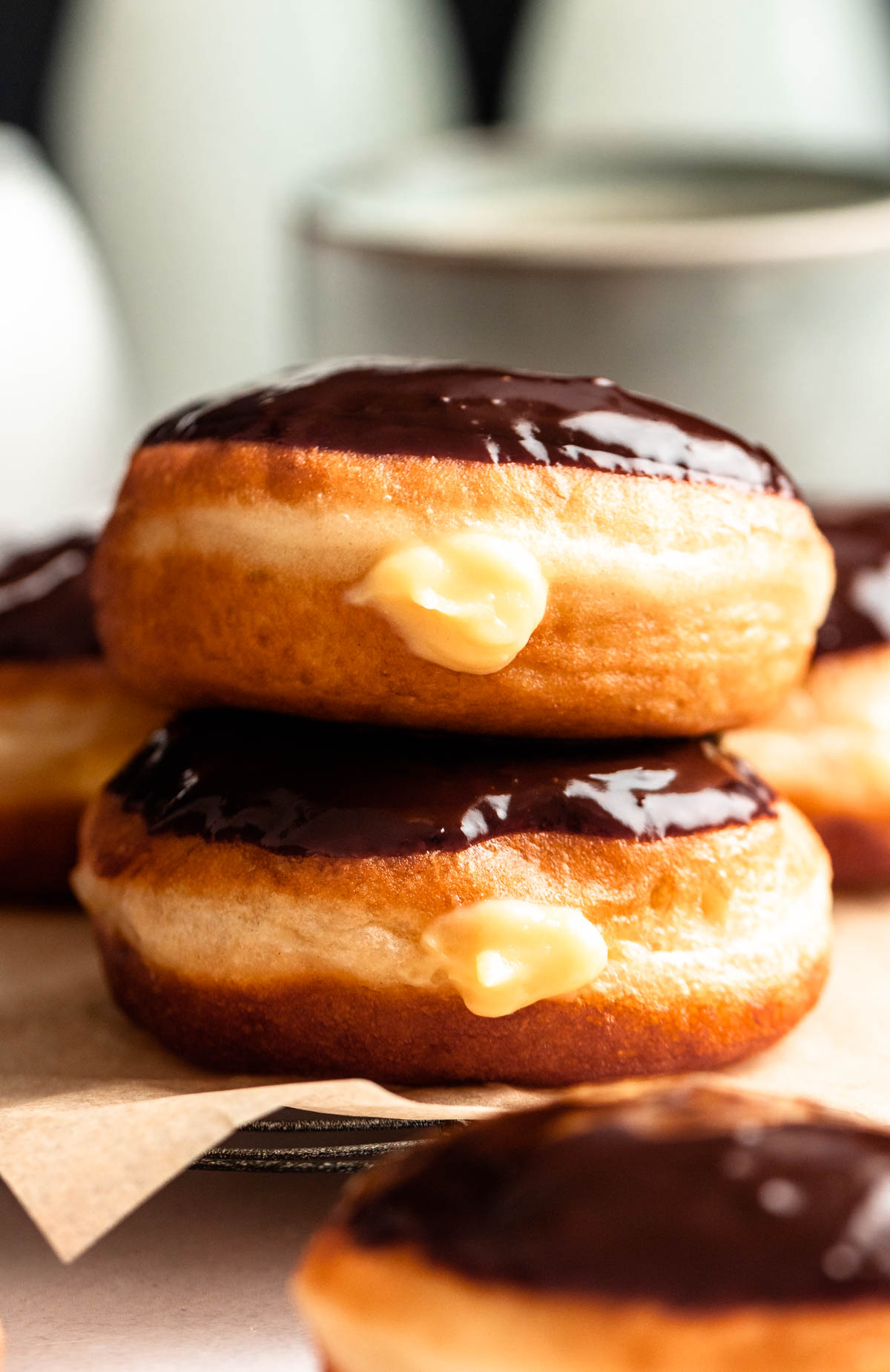 Stack of boston cream donuts.