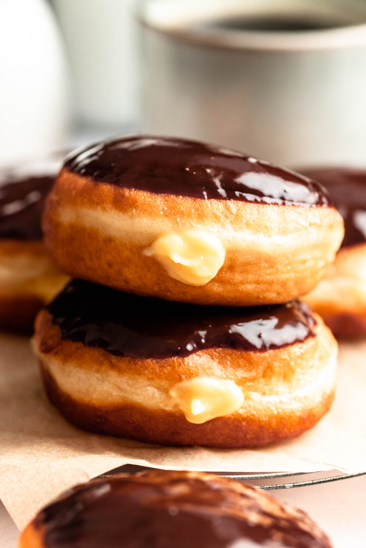 Stack of two Boston cream donuts.