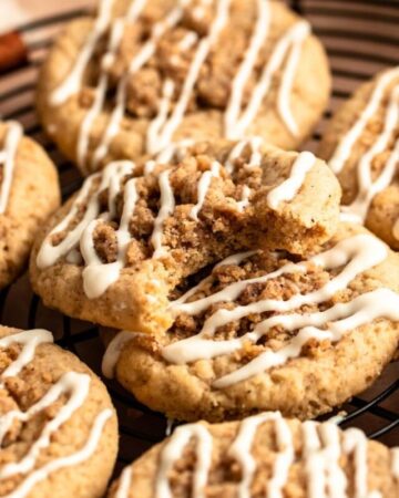 Stack of coffee cake cookies with the top one missing a bite.