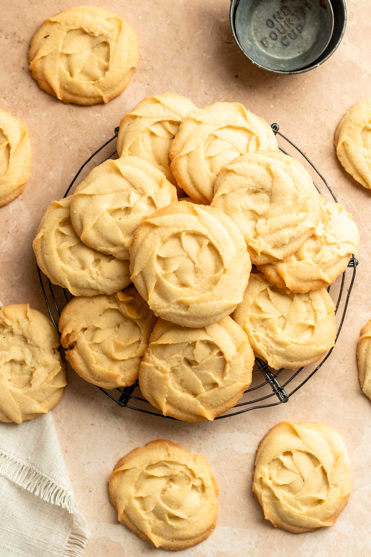 Top of danish butter cookies on a round cooling rack.