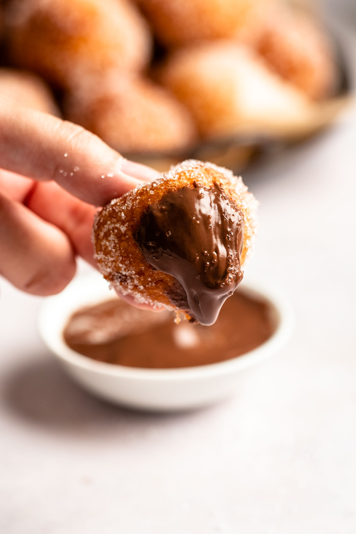 Donut hole dipped in chocolate.