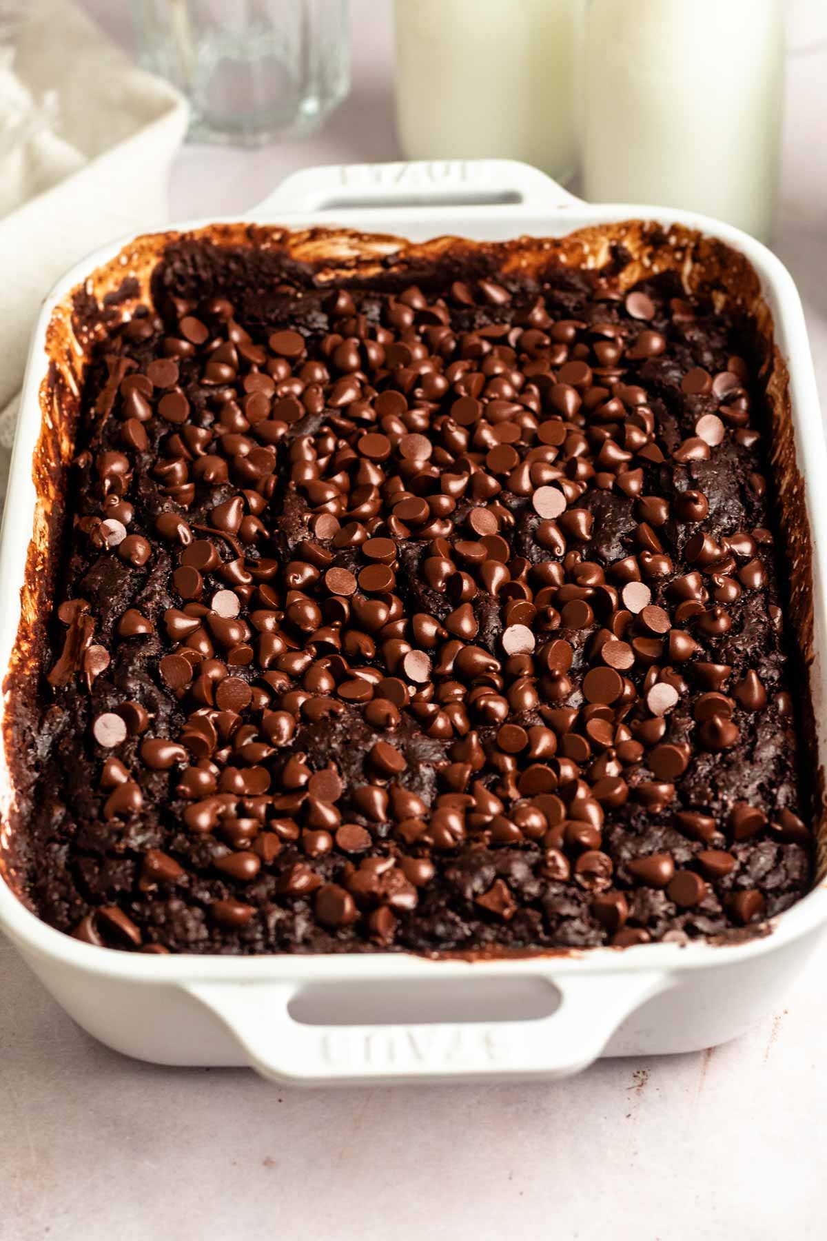 Close up shot of chocolate dump cake with chocolate chips on top.