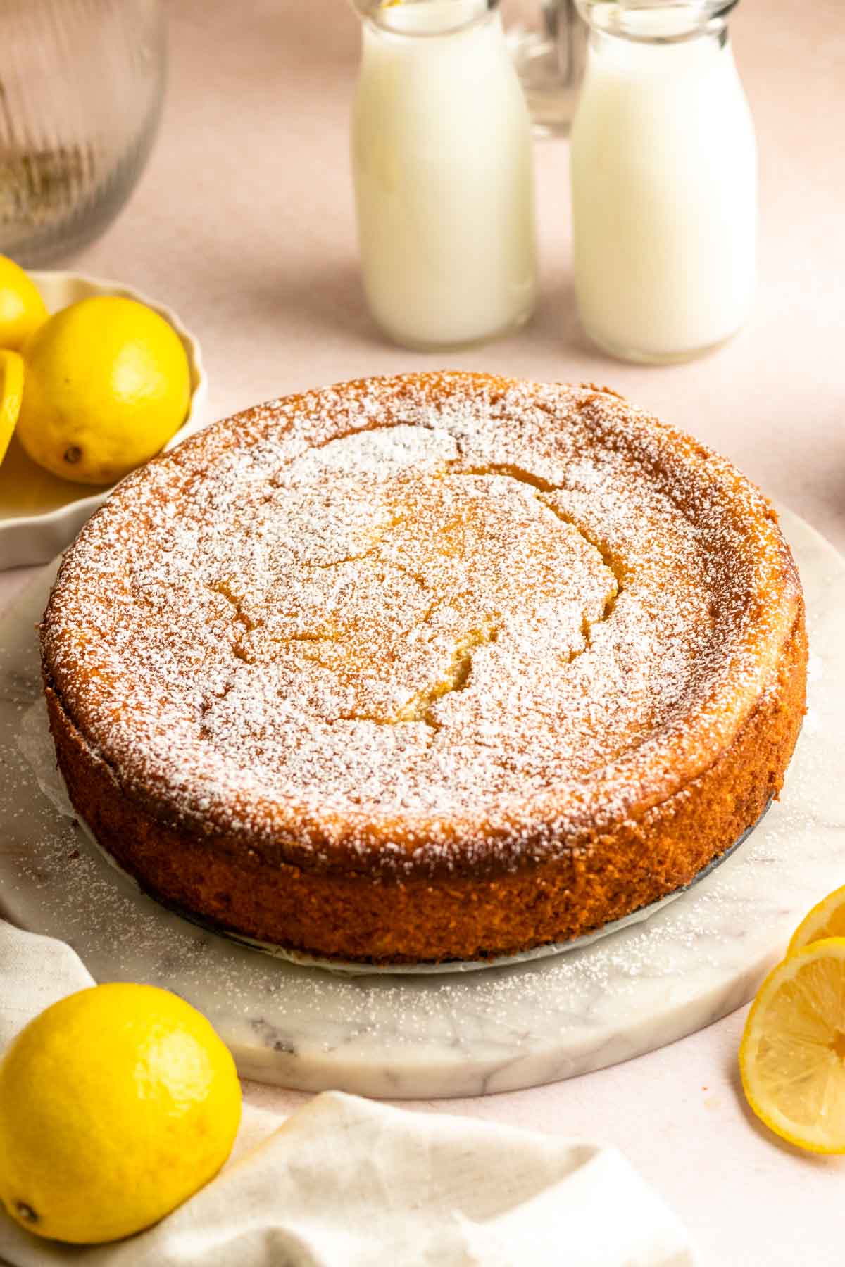 Lemon ricotta cake with powdered sugar on top.
