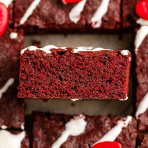 Top of red velvet brownies with a cream cheese glaze.