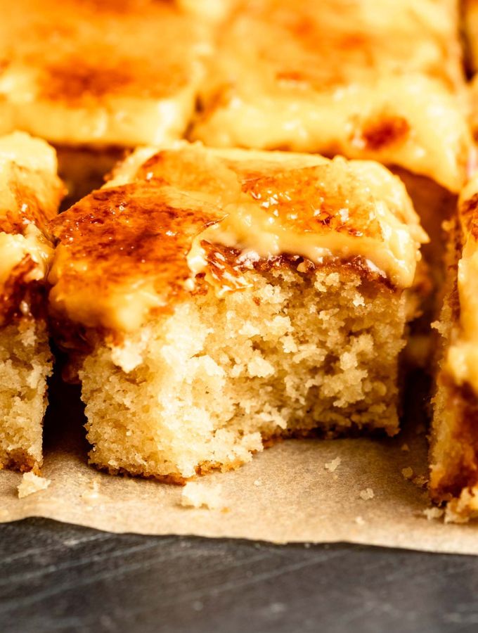 Slice of creme brulee cake with a bite missing.