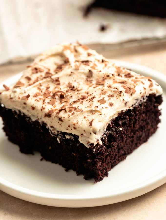Slice of Mexican chocolate cake on a white plate.