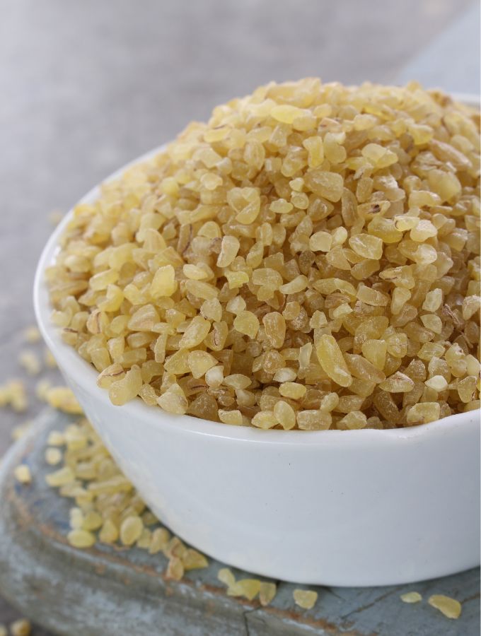 A large white bowl with bulgar wheat.