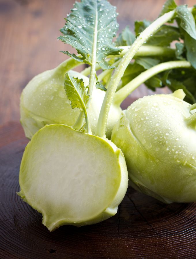 Image of kohlrabi with the middle one cut in half.