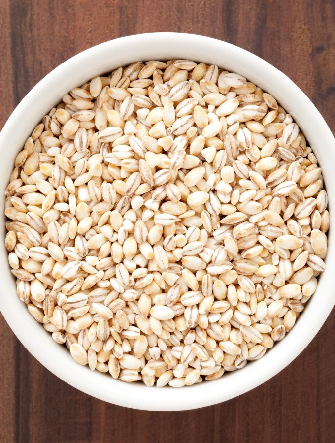 Top of a white bowl with pearl barley.