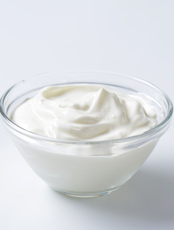 A bowl with full fat sour cream.