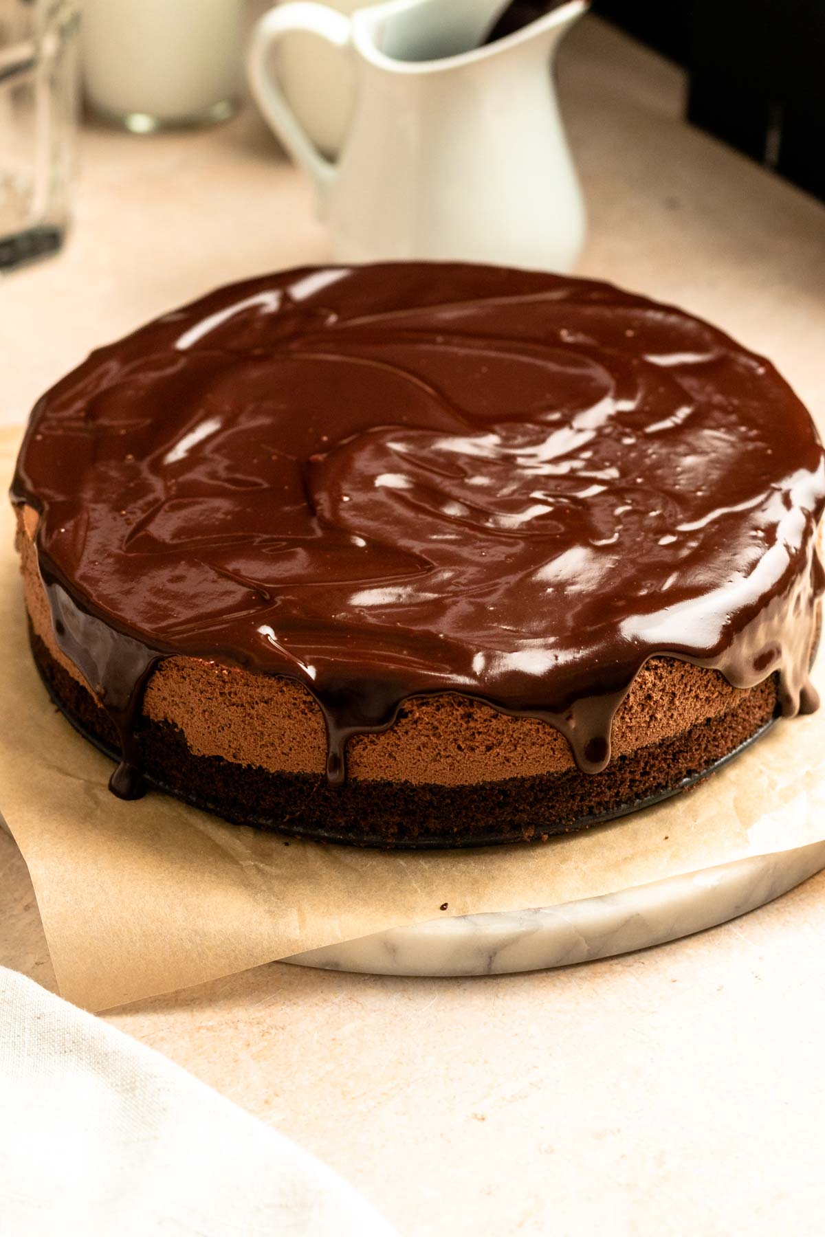 Chocolate mousse cake on a cake plate.