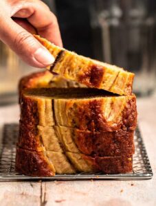 Hand holding a slice of 4 ingredient banana bread.