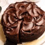 Slice pulled away from a chocolate mayonnaise cake.