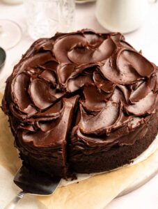 Slice pulled away from a chocolate mayonnaise cake.