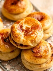 Creme brulee cookie on top of a stack of cookies.