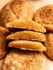 Two brown butter snickerdoodle cookies cut in half.
