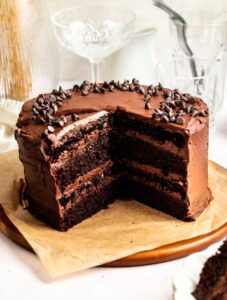 Slice missing from a chocolate espresso cake.