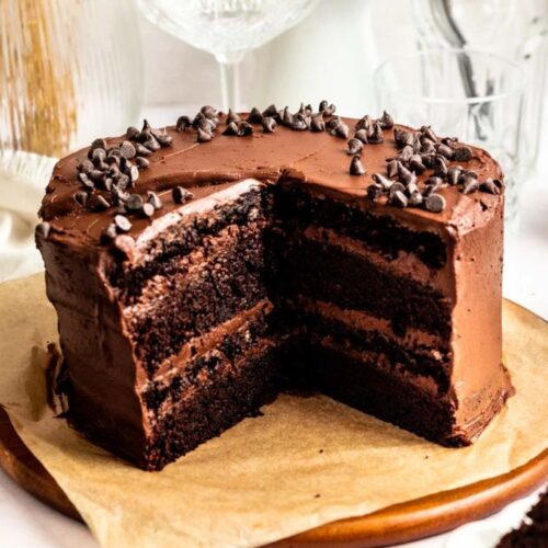 Slice missing from a chocolate espresso cake.