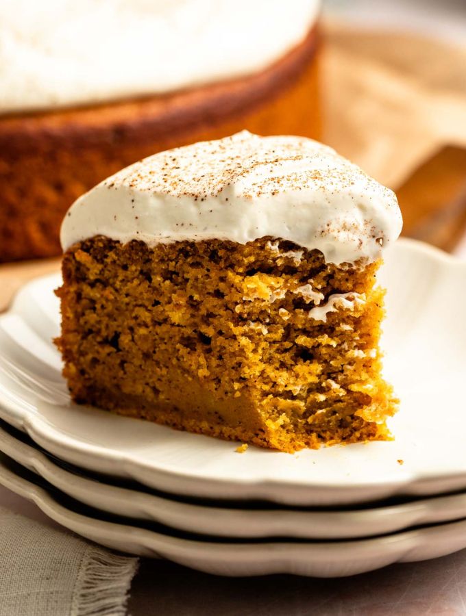 Bite missing from a slice of pumpkin olive oil cake.