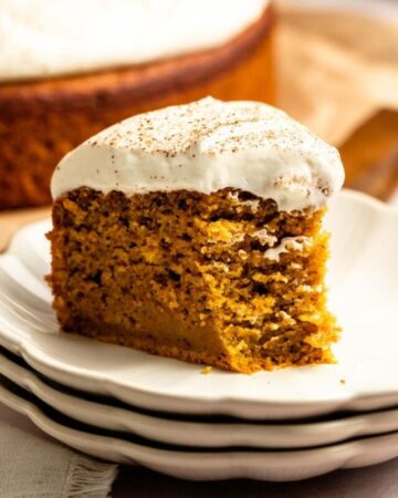 Bite missing from a slice of pumpkin olive oil cake.