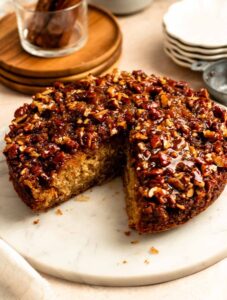 Slice missing from a pecan upside down cake.
