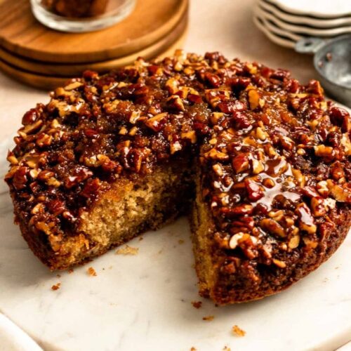 Slice missing from a pecan upside down cake.