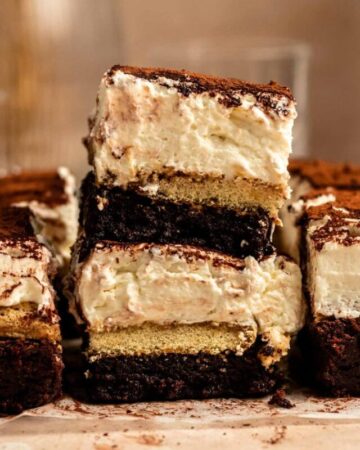 Stack of two sliced of tiramisu brownies.