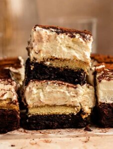Stack of two sliced of tiramisu brownies.