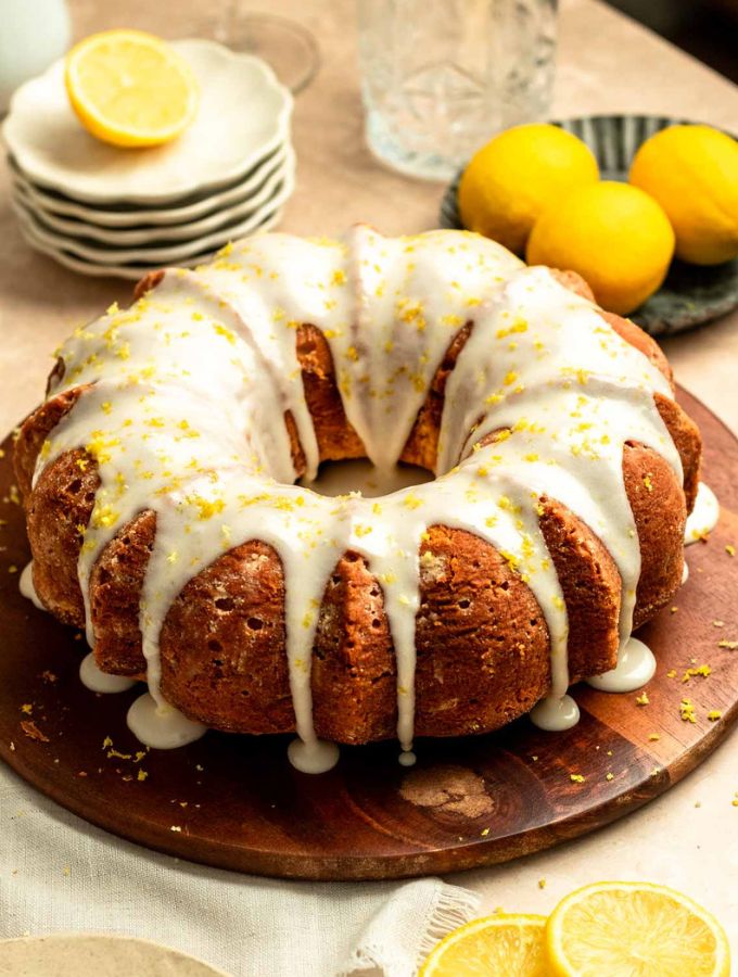 Lemon cream cheese pound cake on a wood plate.