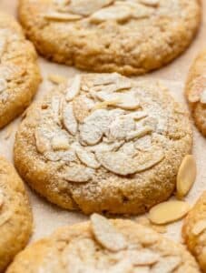 Almond croissant cookies with powdered sugar on top.