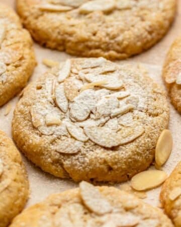 Almond croissant cookies with powdered sugar on top.