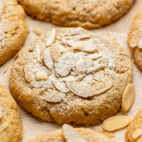 Almond croissant cookies with powdered sugar on top.
