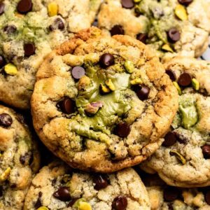 Top of pistachio chocolate chip cookies with pistachio cream.