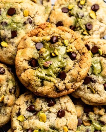 Top of pistachio chocolate chip cookies with pistachio cream.