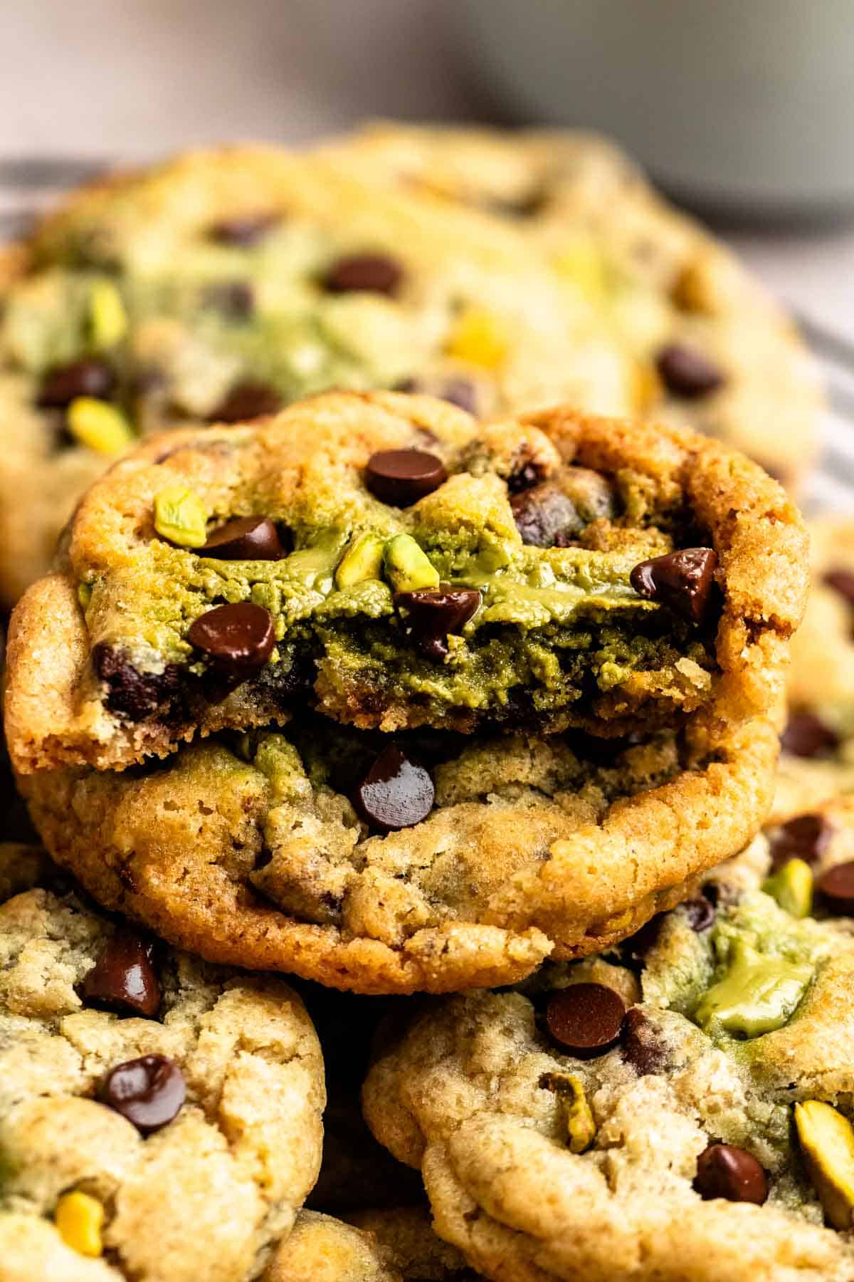 Pistachio chocolate chip cookie cut in half.