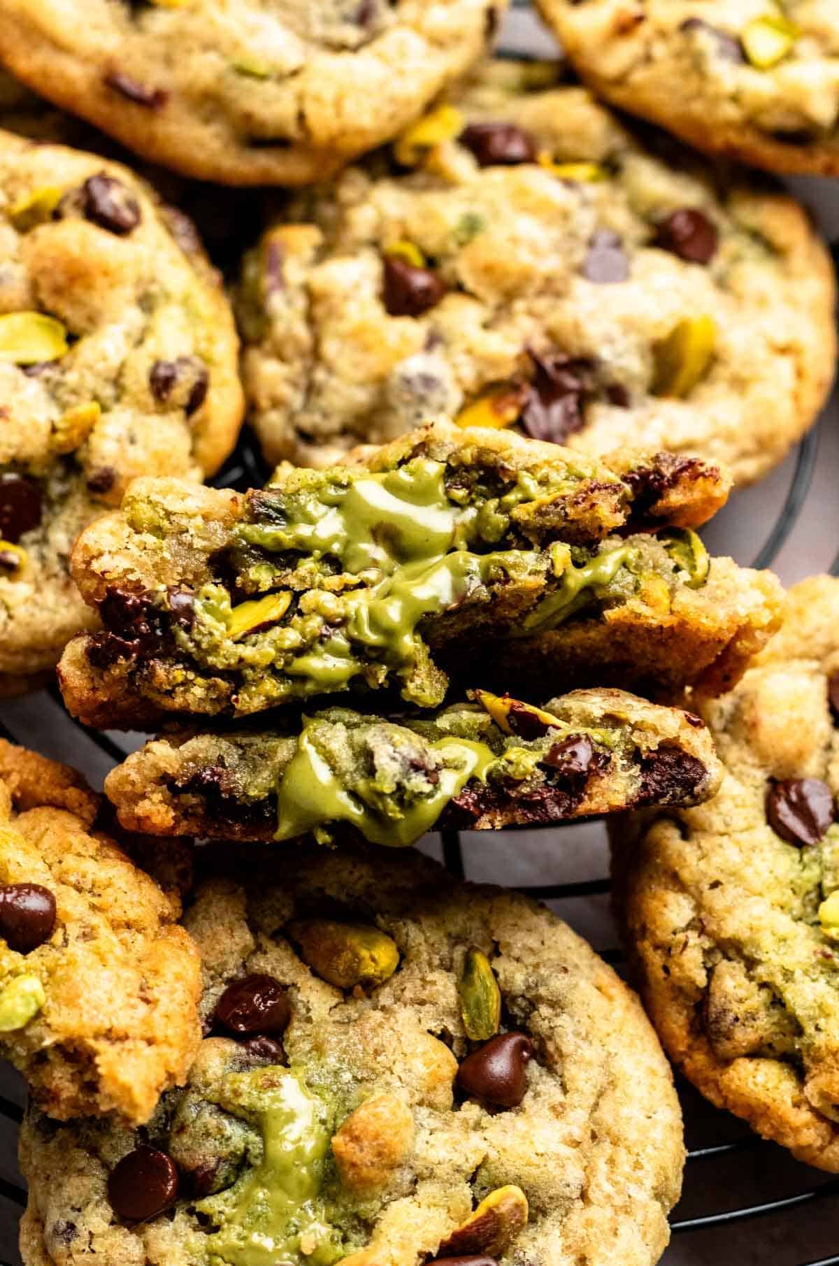 Pistachio chocolate chip cookies cut in half.