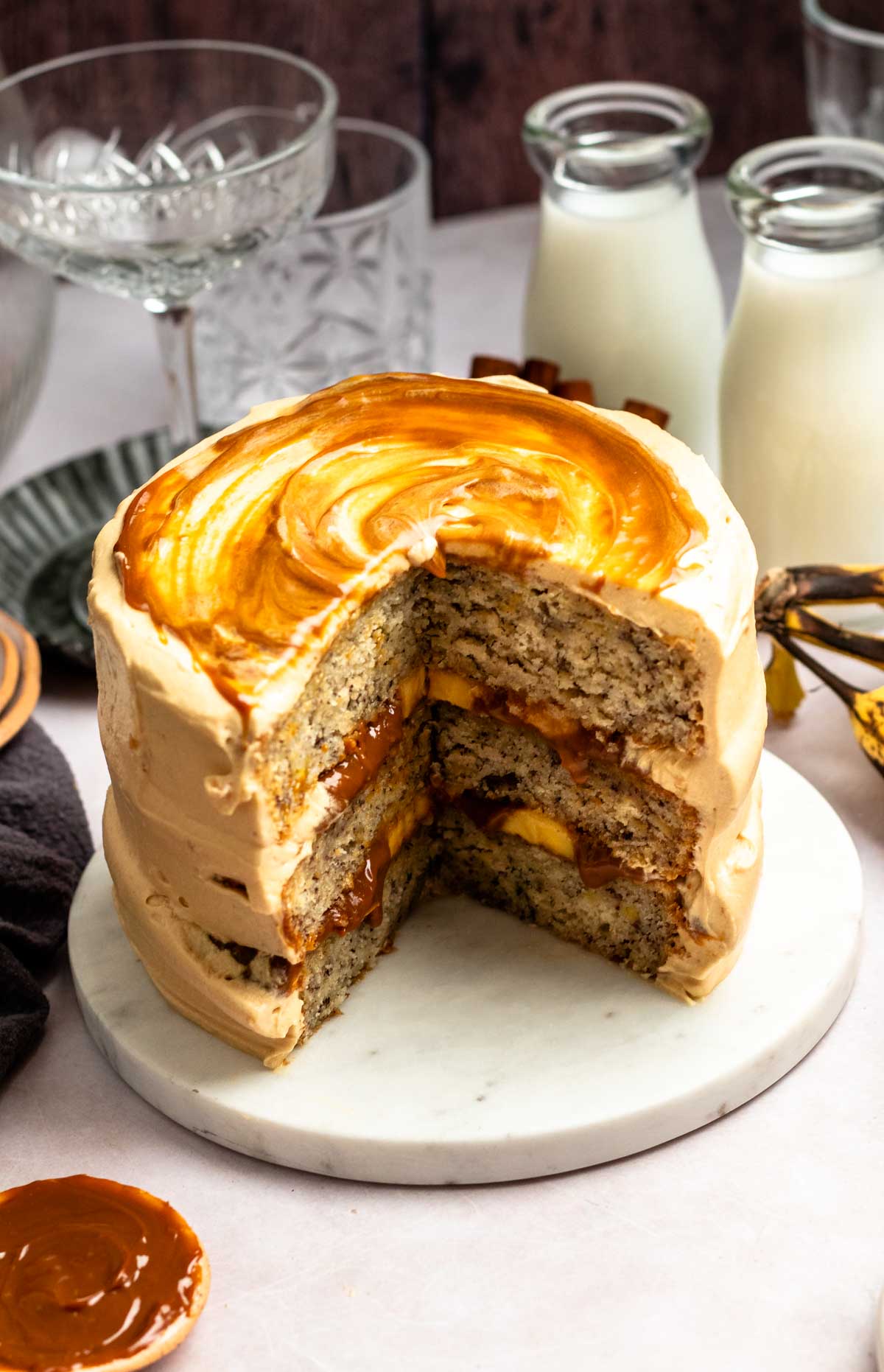 Slice missing from a banoffee cake.