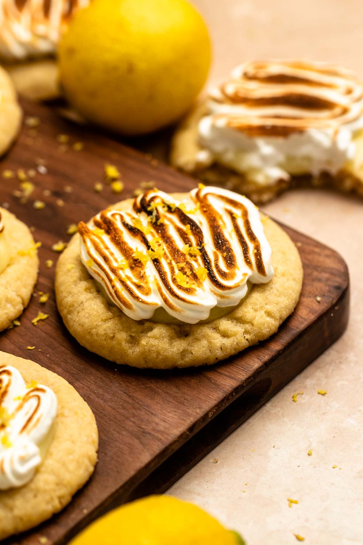 Lemon meringue cookies on a wooden board.