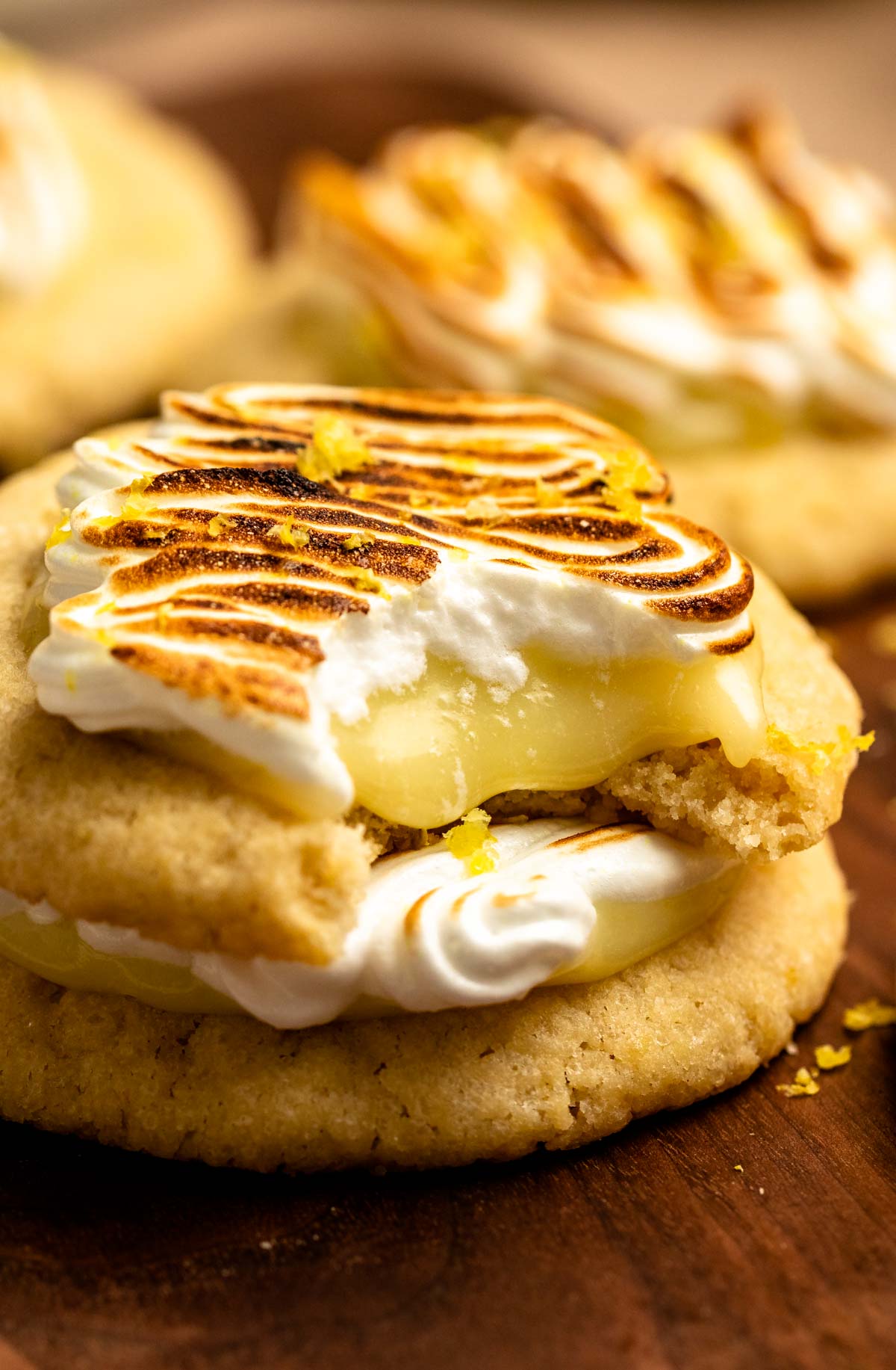 Bite missing from a lemon meringue cookie.