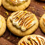 Lemon meringue cookies on a wooden board.