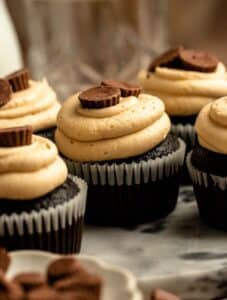 Close up shot of chocolate peanut butter cup cupcakes.
