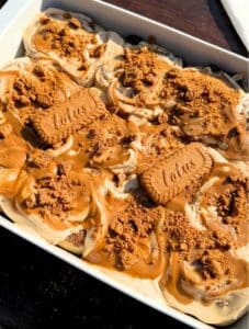 Biscoff cinnamon rolls in a baking pan.